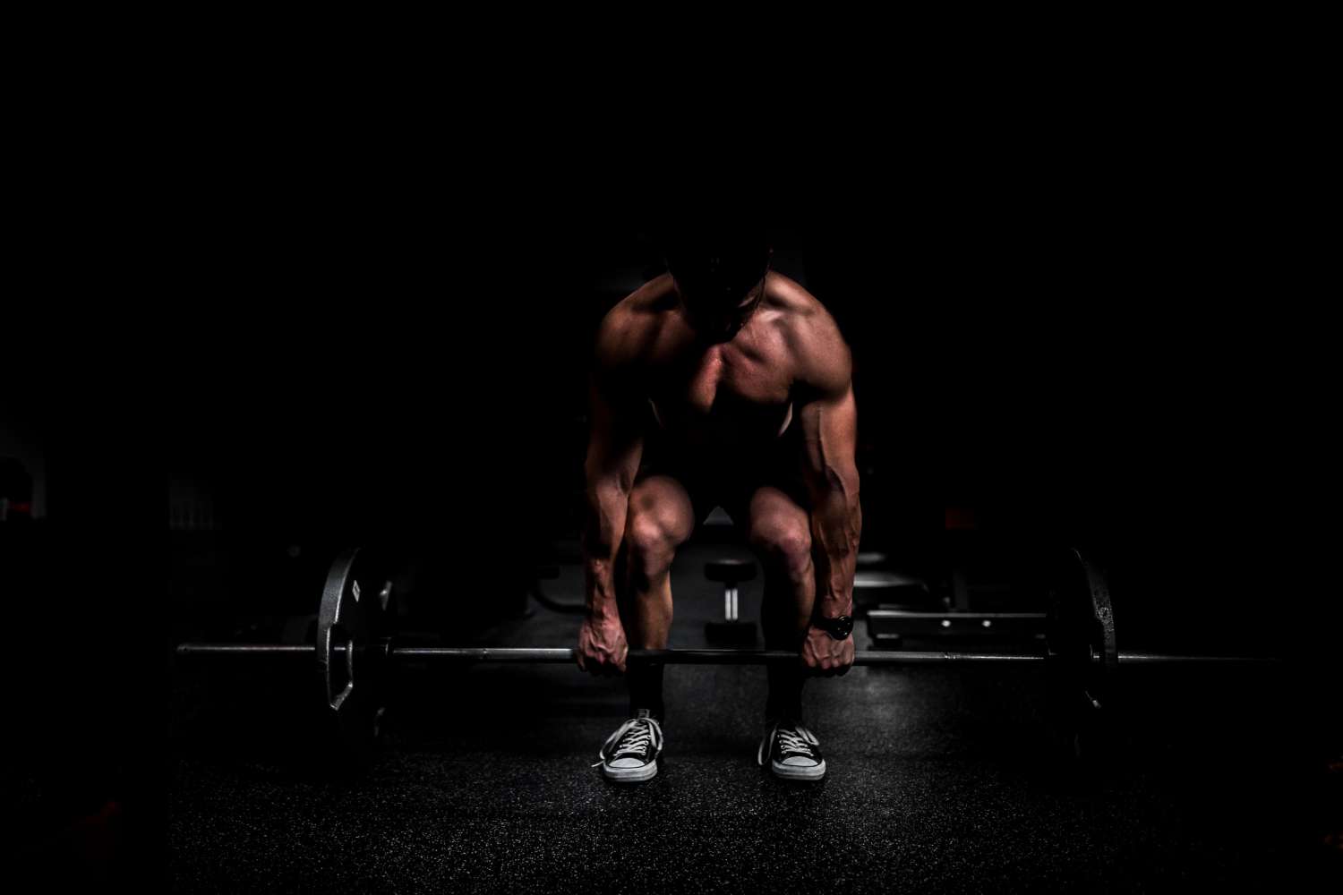 VGL Fitness Anabolic Steroids UK man dead lifting a barbell with weights,